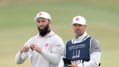 Jon Rahm and his caddie, Adam Hayes discuss a shot during the 2024 Alfred Dunhill Links Championship