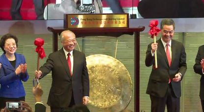 Watch Chinese officials ring the opening gongs of the Hong Kong-Shanghai linked stock exchanges