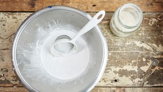 A sieve on a wooden work top