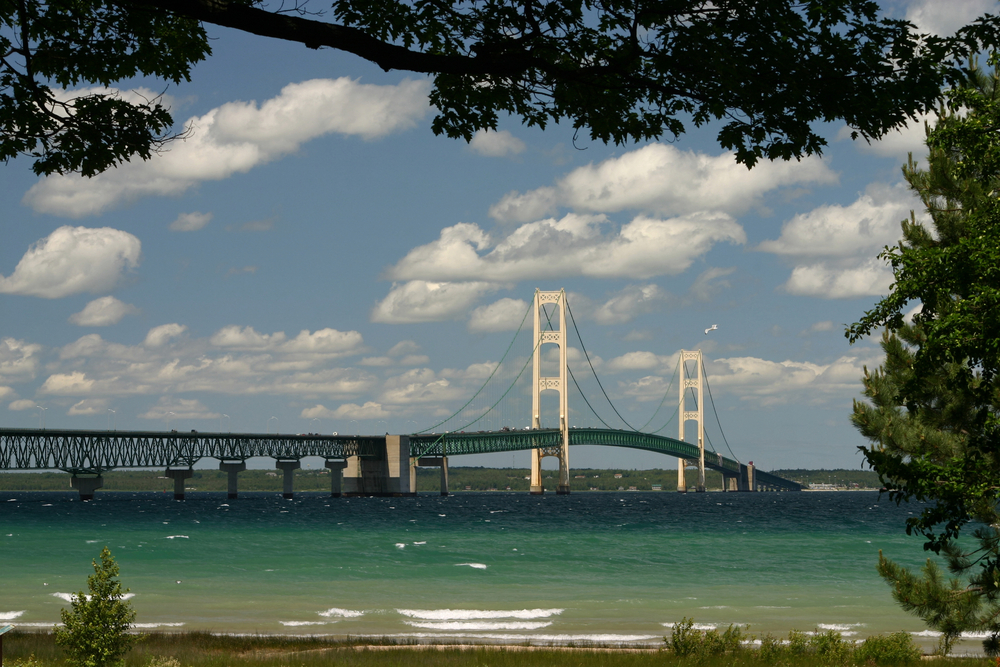 The Mackinac Bridge connects Michigan&#39;s Upper and Lower Peninsulas at the straits between Lake Huron and Lake Michigan.