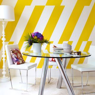 dining room with yellow textured wall and dining table
