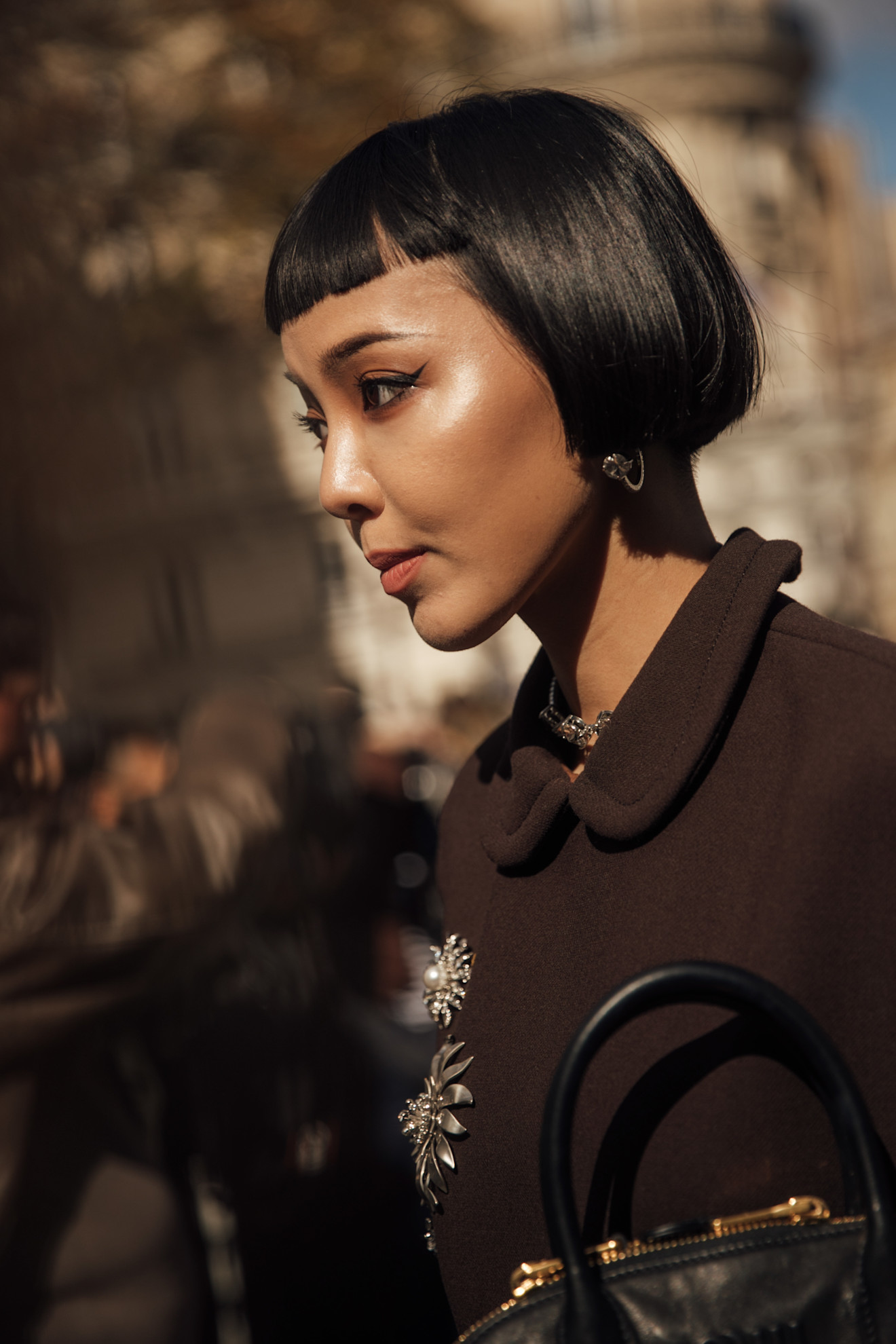 Micro French Bob on a model with a dark brown jacket