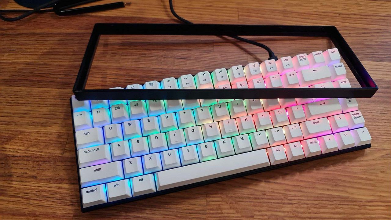 Vissles V84 gaming keyboard on a desk with RGB enabled