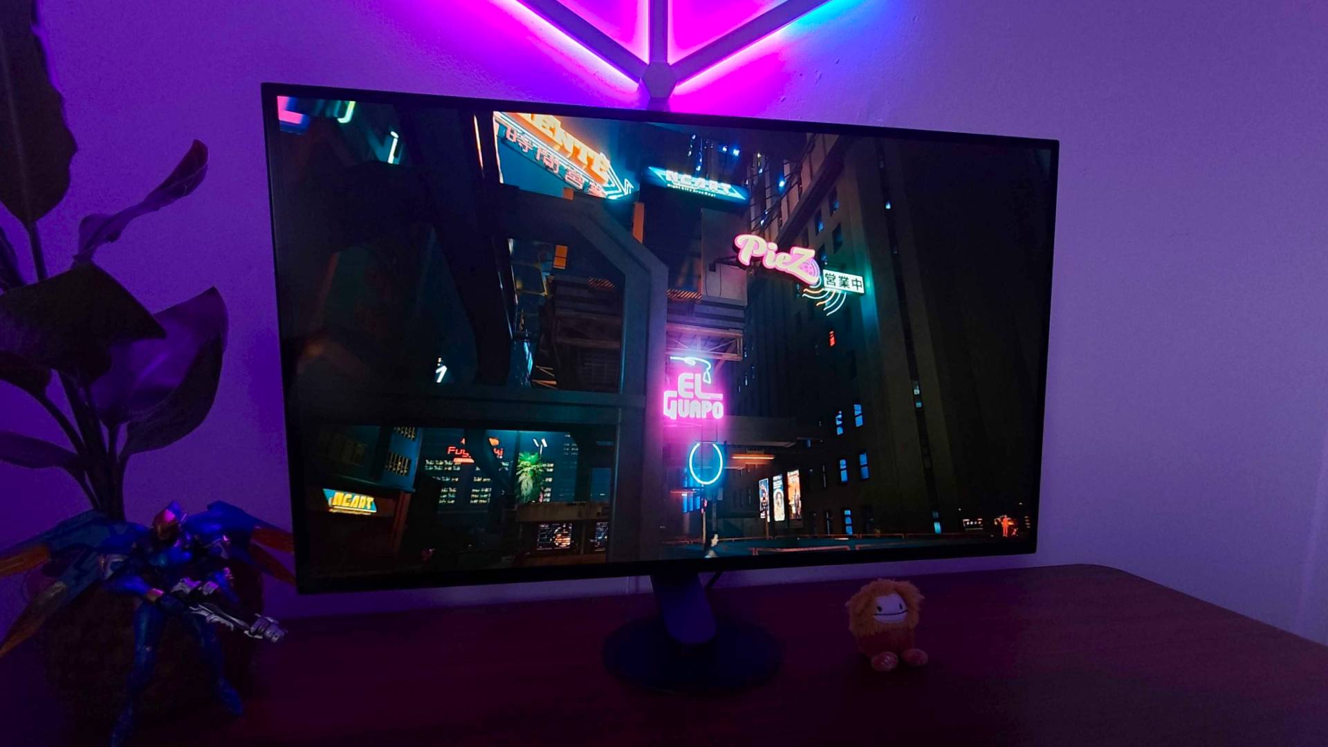 Sony Inzone M10S with Cyberpunk 2077 gameplay on screen featuring neon signs with HDR switched on