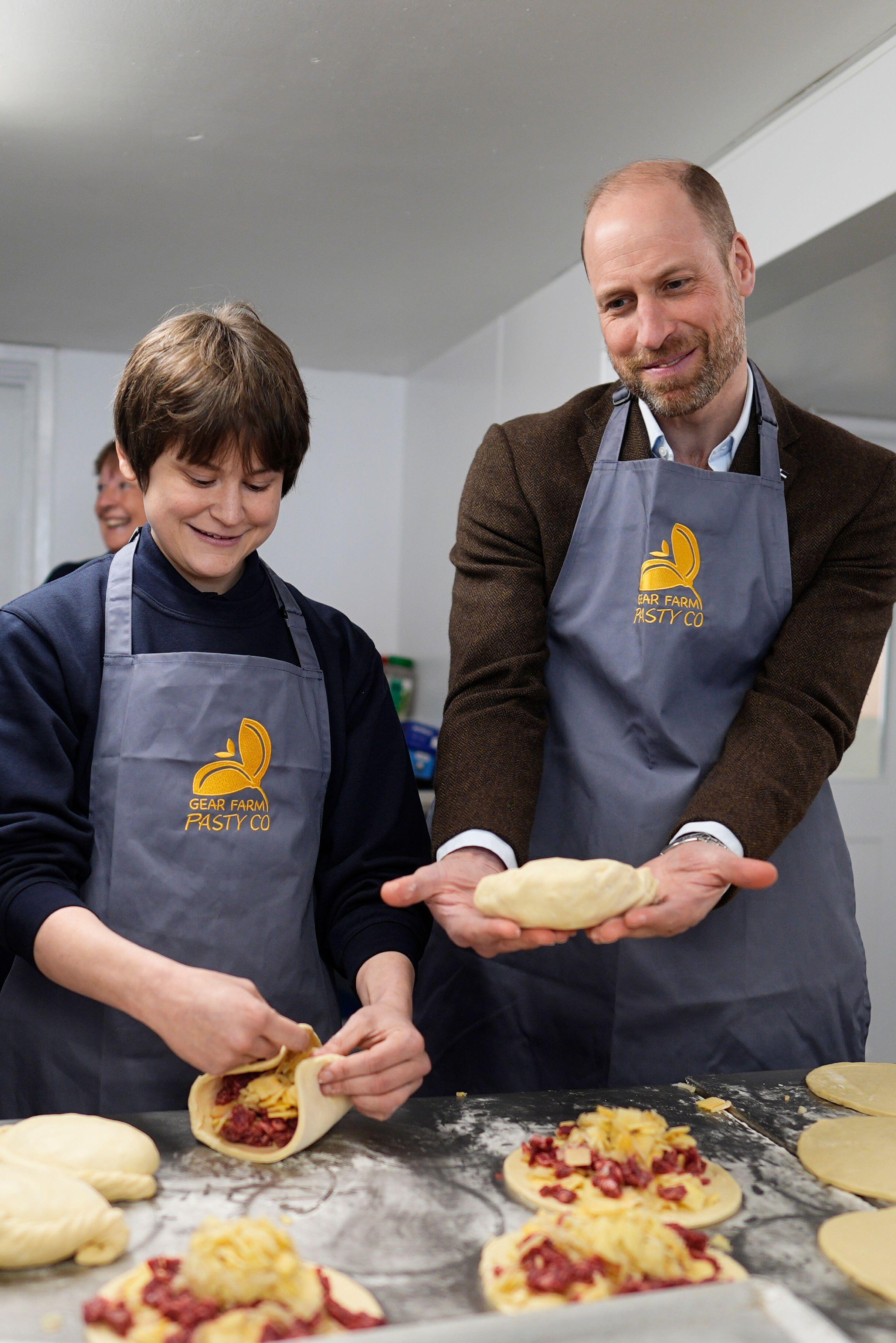 3DY0W08 The Prince of Wales, known as the Duke of Cornwall while in Cornwall, tries his hand at crimping pasties during his visit to the Gear Farm Pasty Company, a family-run farm known for producing traditional Cornish pasties in St Martin, Helston, as he visits Cornwall for St Piran's Day. Picture date: Thursday March 5, 2026.