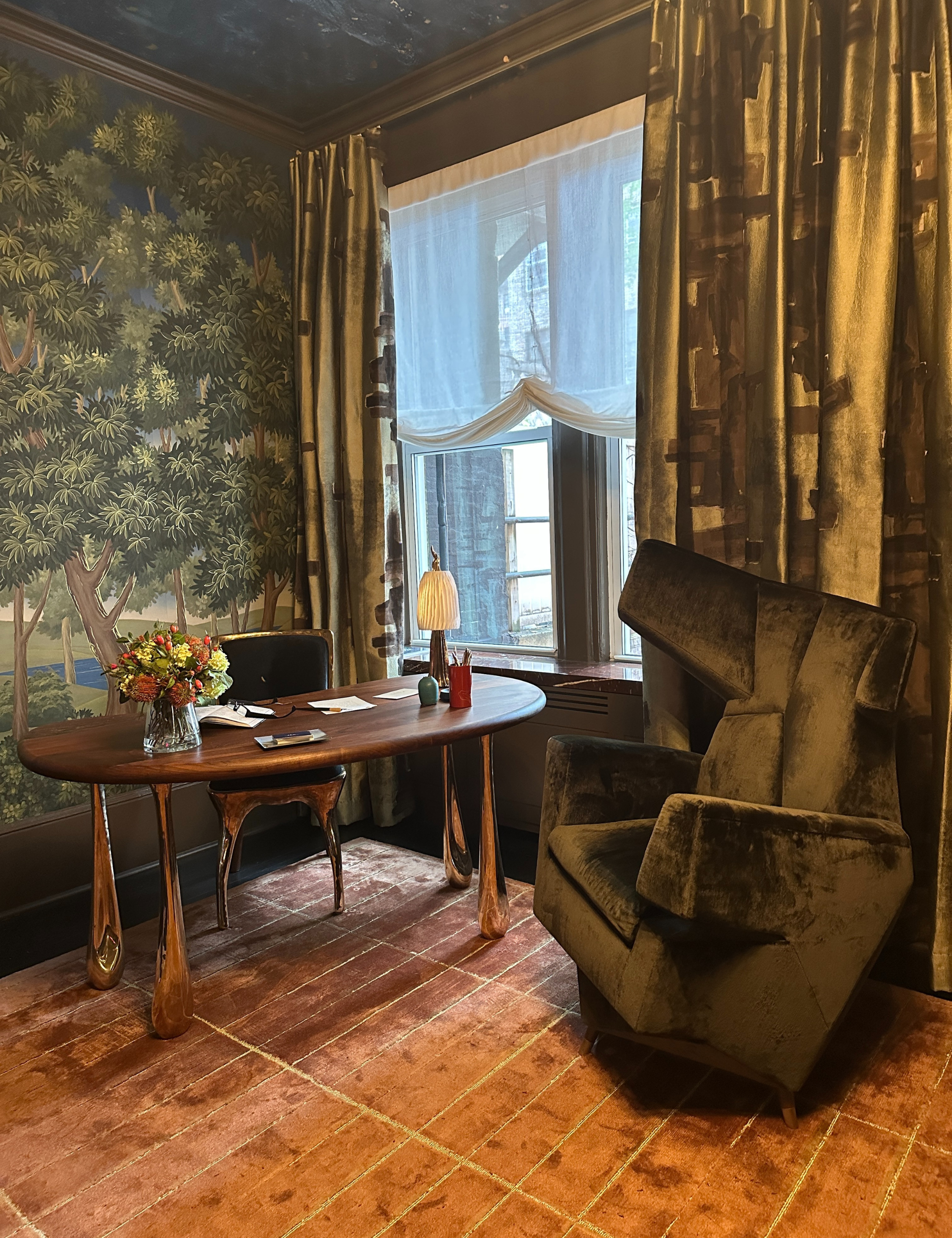 Office area featuring a metallically-accented desk and matching chair