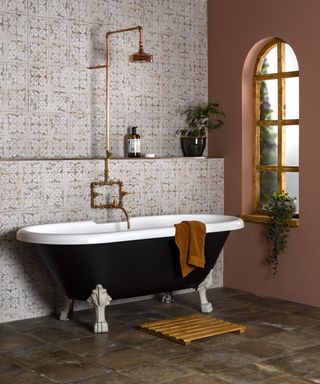 Anchor Chalk Tiles with black freestanding bath and ocher painted wall by Walls and Floors