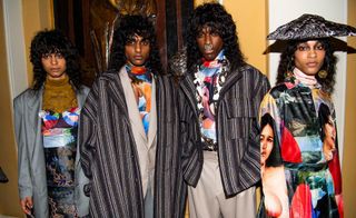 4 models stood together wearing various patterned clothing