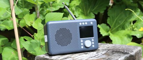 the pure elan connect dab radio in black on a garden table