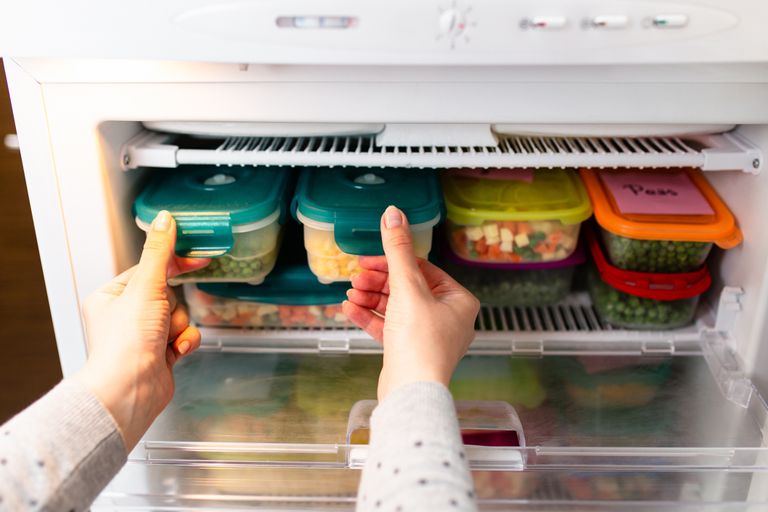 upright freezer - food neatly stacked in freezer