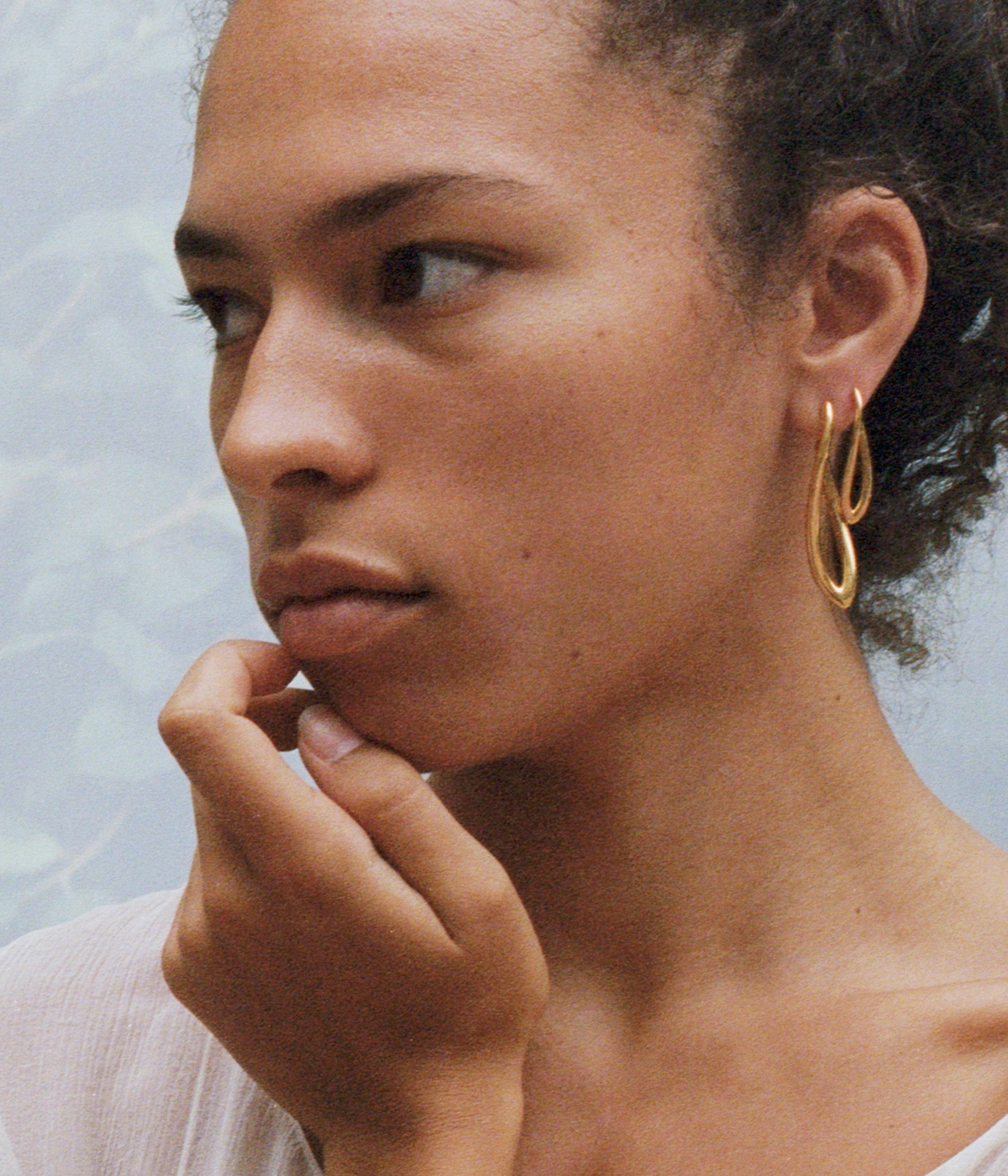 woman wearing gold jewellery