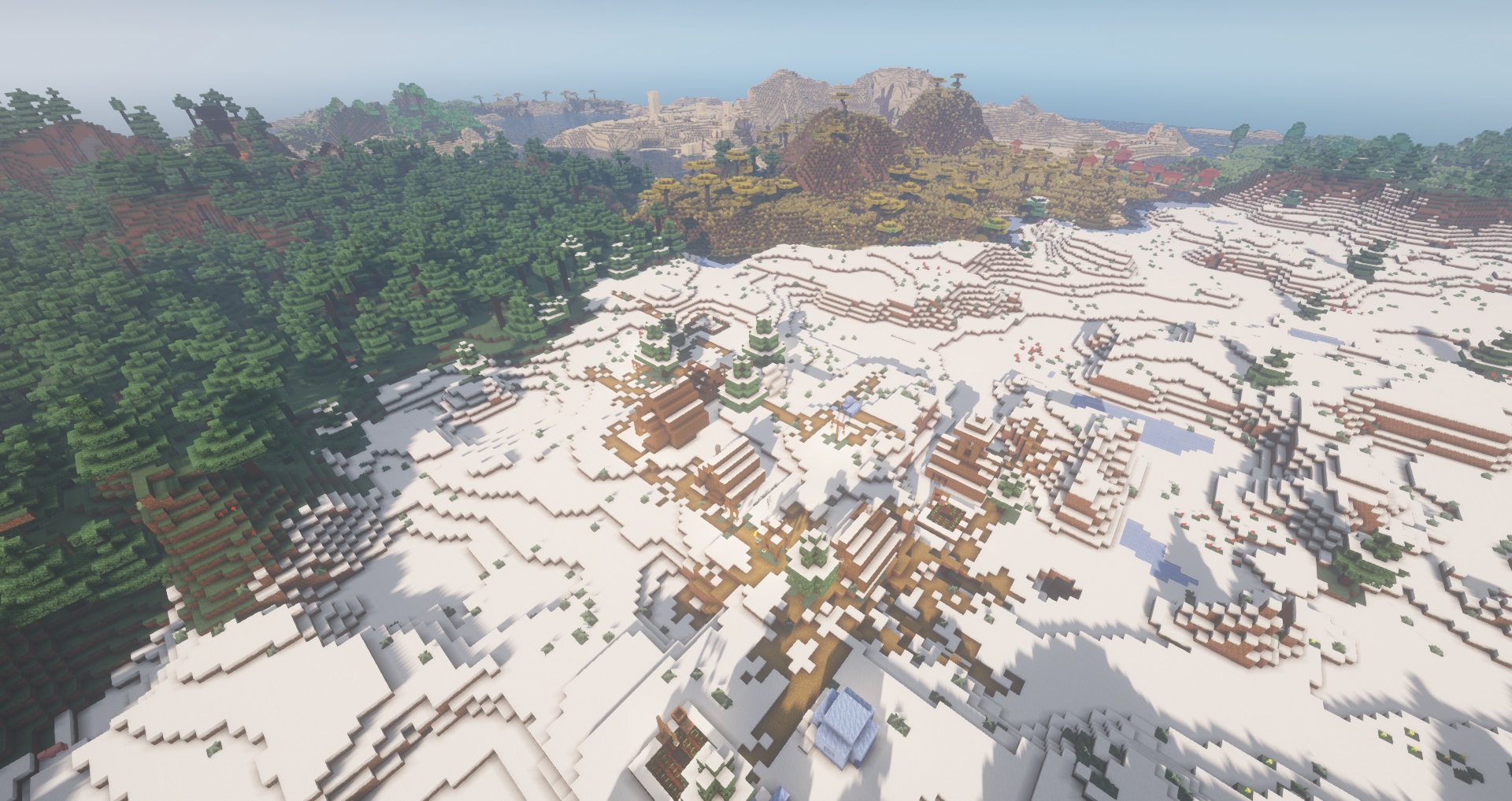 Minecraft seeds - four villages at spawn - a snowy Minecraft village seen from above with three other biome villages in the distance