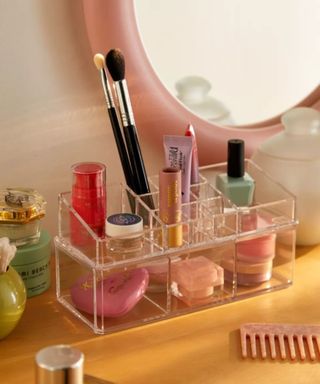 A makeup organizer with makeup in it