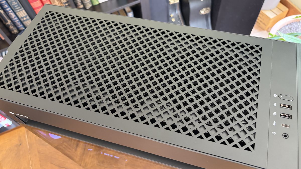 Top view of a black Omen Max 45L computer case with a ventilated design and USB ports on the side.