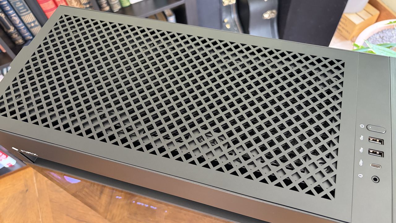 Top view of a black Omen Max 45L computer case with a ventilated design and USB ports on the side.