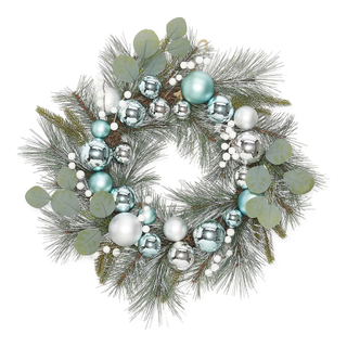 A silvery green Christmas wreath with blue baubles throughout