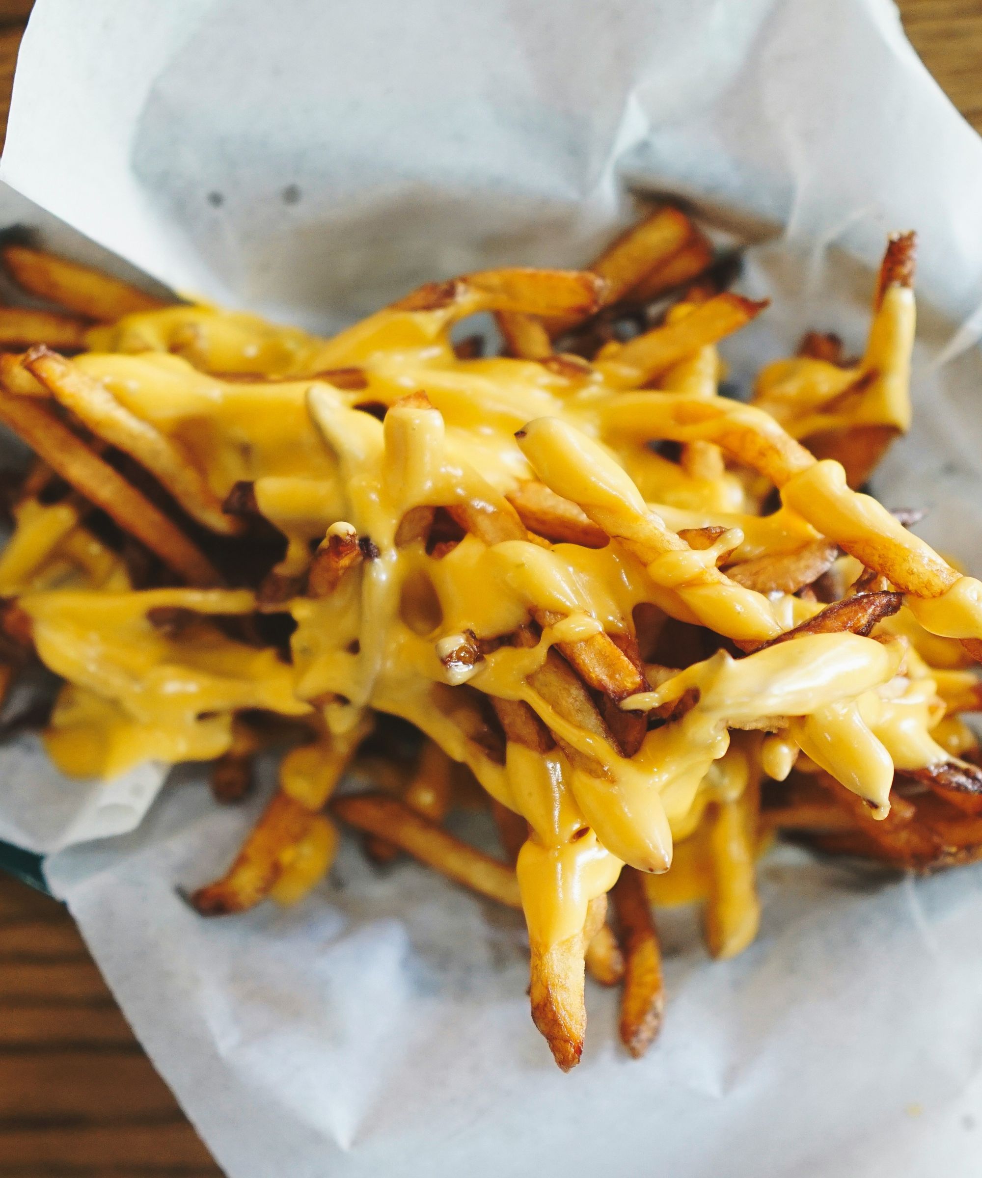 Cheesy fries in paper