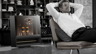 LG DukeBox lifestyle image with a relaxing man