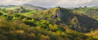 Thor's Cave, illuminated by early light