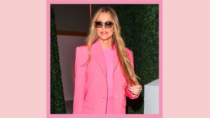 Khloe Kardashian wears a hot pink suits and sunglasses and she's seen on August 24, 2022 in Los Angeles, California/ in a pink template