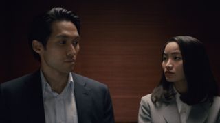 Solomon (Jin Ha) and Naomi (Anna Sawai) in an elevator in "Pachinko" season 2