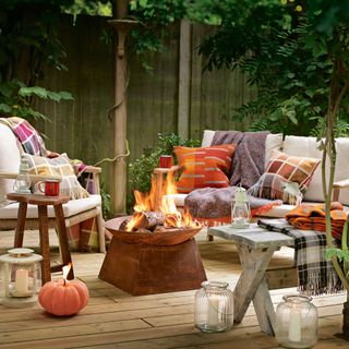 Fire pit on decking with garden seating