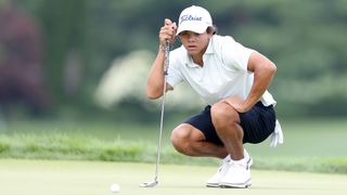 Charlie Woods lines up a putt at the US Junior Amateur