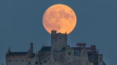 The July Full Moon rises behind St Michael's Mount in Penzance, July 28, 2026