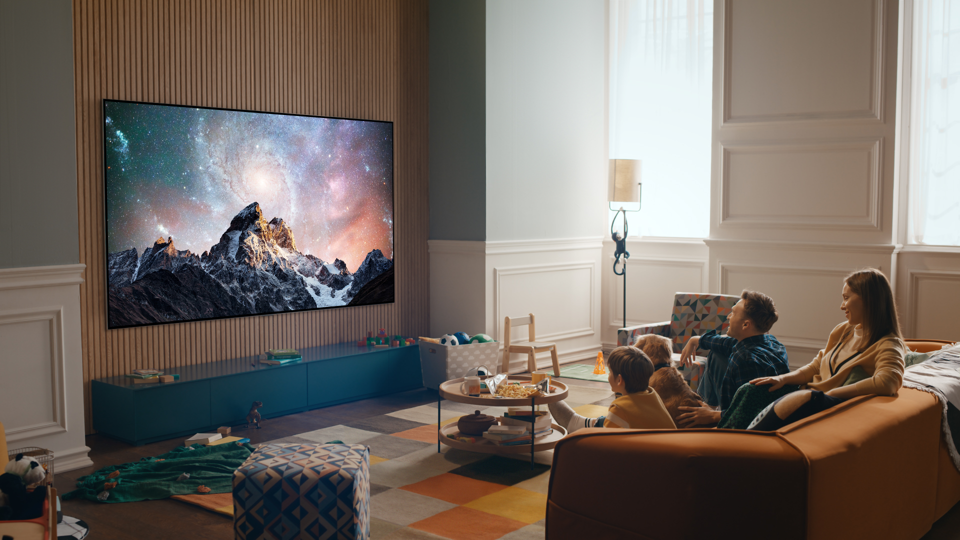 The LG G2 Gallery Series TV hanging on the wall displaying a mountain scene