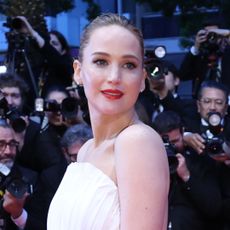 Jennifer Lawrence wears a white custom Dior gown to Cannes Film Festival