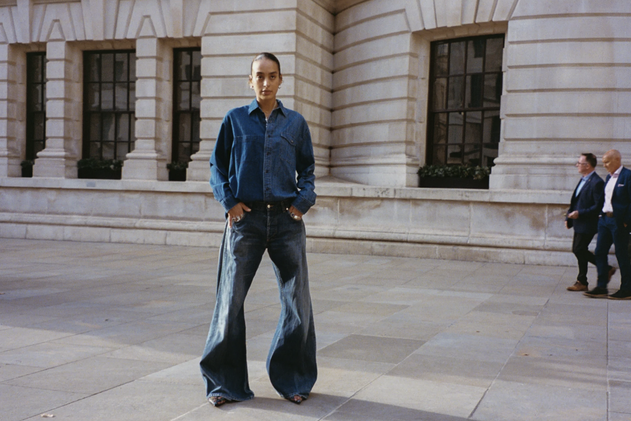 A model wears E.L.V Denim jeans and a shirt