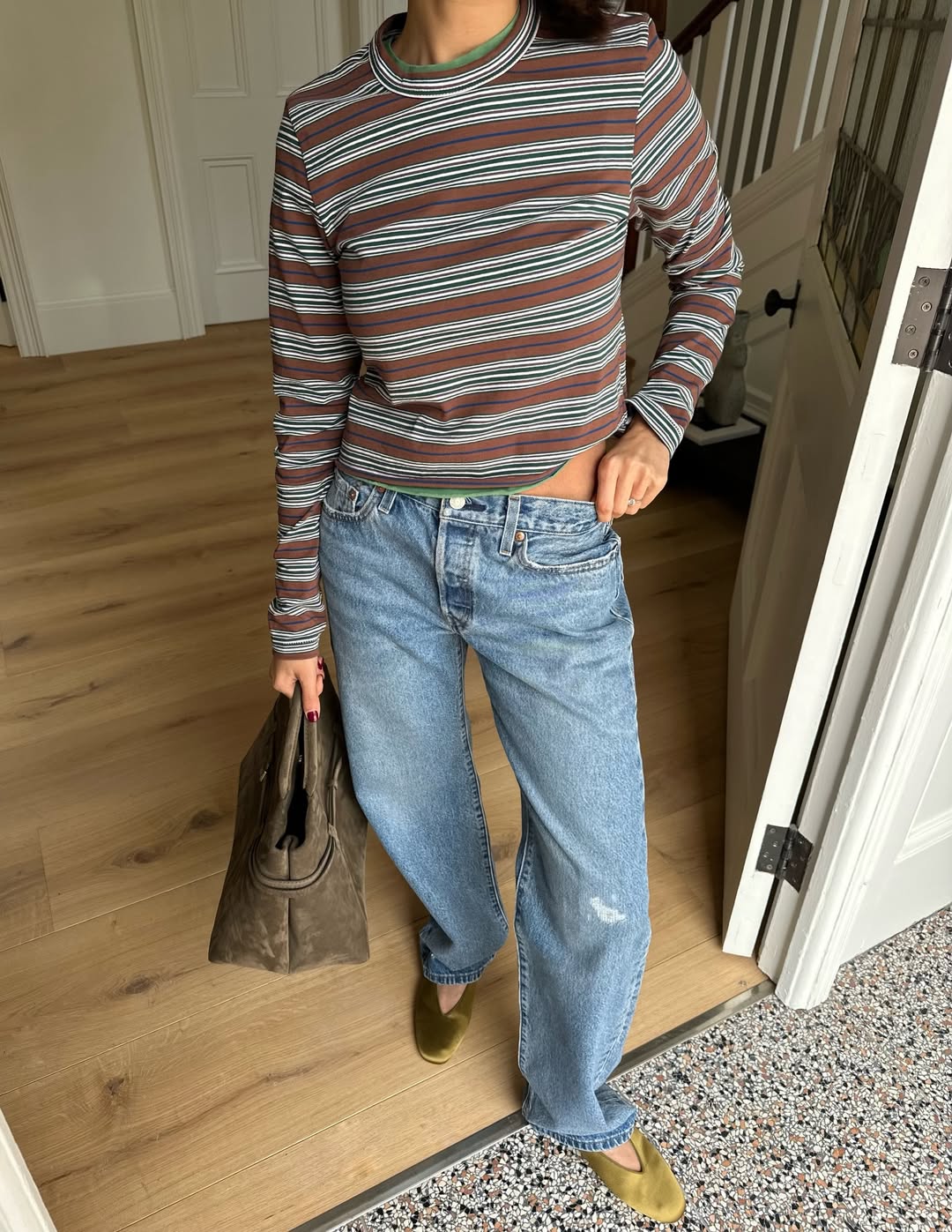 influencer @smythsisters wears a striped long sleeve t-shirt with jeans