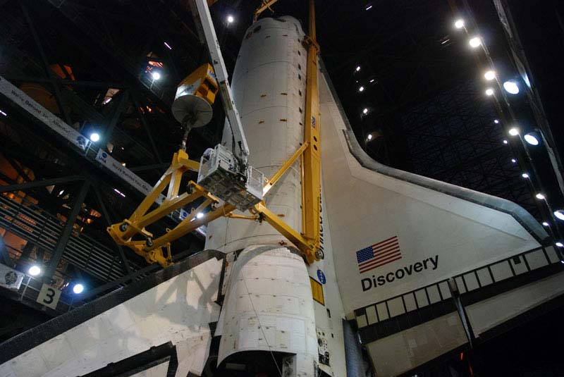 NASA’s space shuttle is positioned to attach the fuel tank and boosters for its final mission.