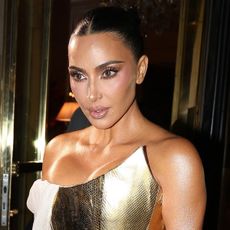 Kim Kardashian's 45th birthday dinner dress with a gold corset