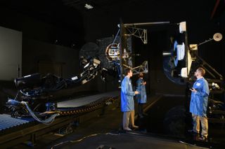 Northrop Grumman engineers conducting a docking test on the ground to check technology for the MEV-1 satellite servicing mission.