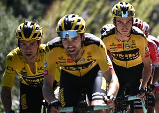 Team Jumbo rider Slovenias Primoz Roglic l wearing the overall leaders yellow jersey climb flanked by his teammate Team Jumbo rider US Sepp Kuss R during the fourth stage of the 72nd edition of the Criterium du Dauphine cycling race 153 km between Ugine and Megeve on August 15 2020 Photo by AnneChristine POUJOULAT AFP Photo by ANNECHRISTINE POUJOULATAFP via Getty Images