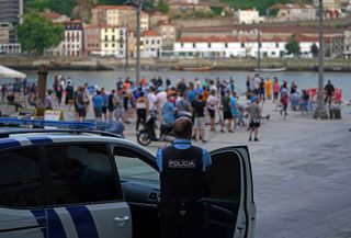 Police watch over Manchester City fans in Porto ahead of the UEFA Champions League final in Porto