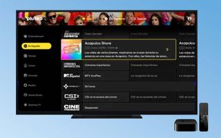 The Pluto TV channel grid on a TV connected to an Apple TV