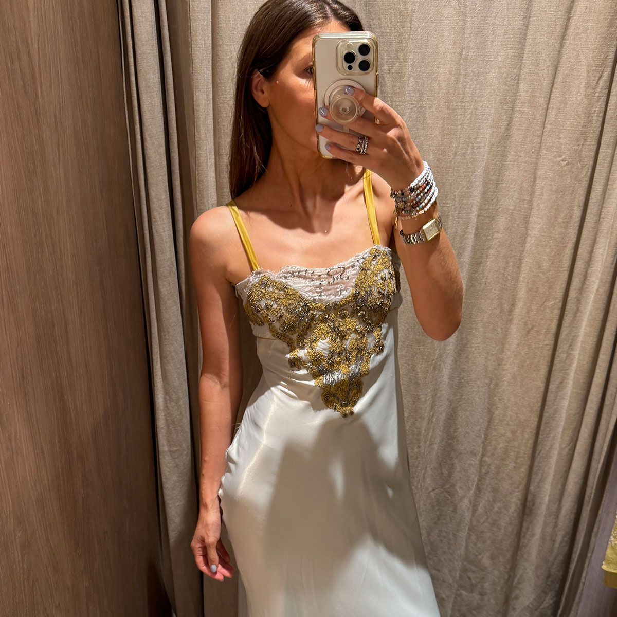 Woman in a satin and beaded dress