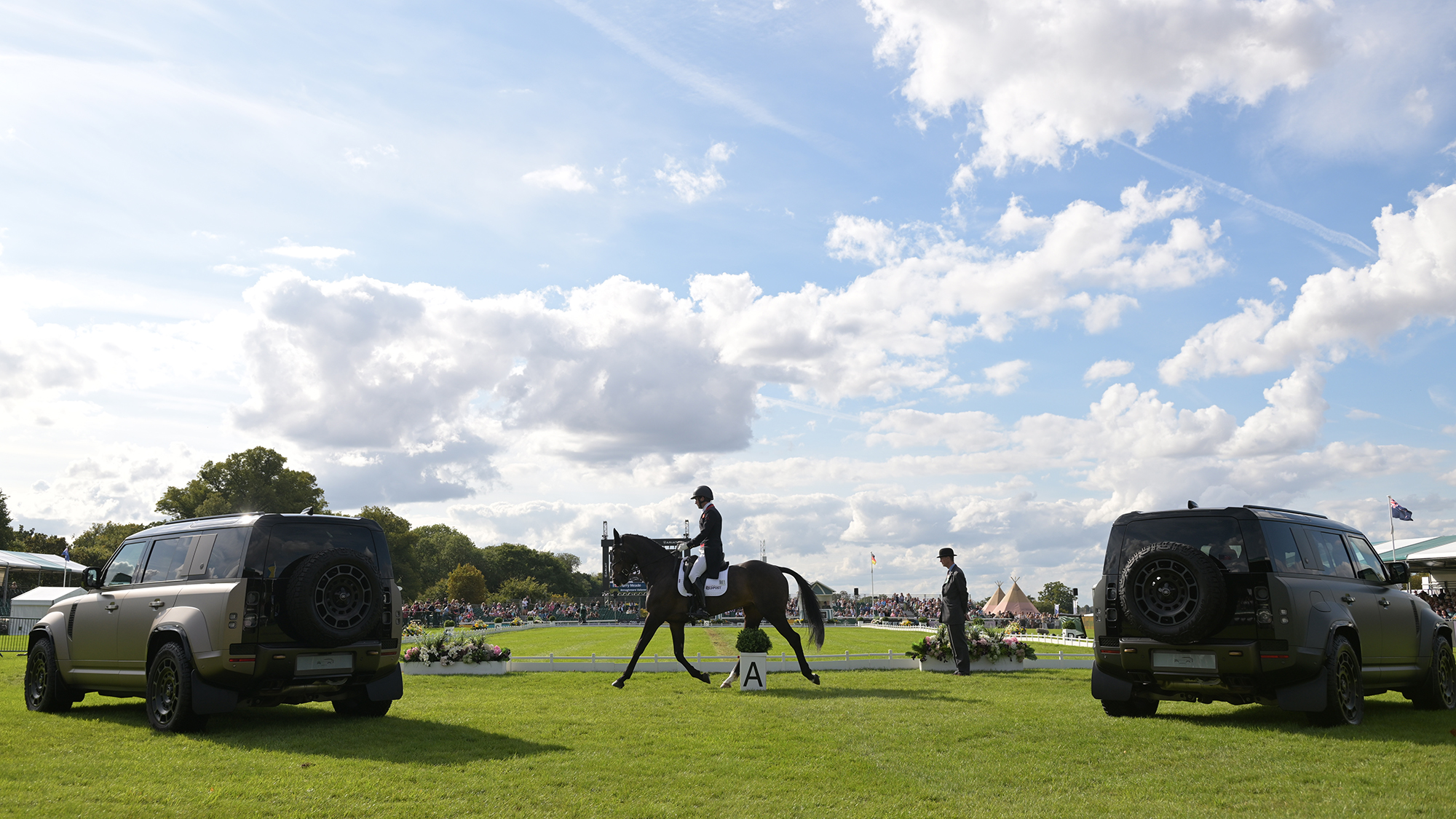 Harry Meade riding Annaghmore Valoner around the outside of the arena before starting his dressage test at Burghley Horse Trials 2025