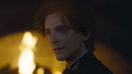 Timothee Chalamet in front of a fire in Dune Part 3