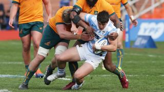 Tomas Cubelli of Argentina is tackled by Marika Koroibete of Australia