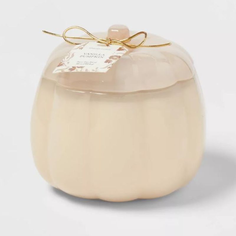 A glass pumpkin-shaped scented candle is one of the best Target fall decor.