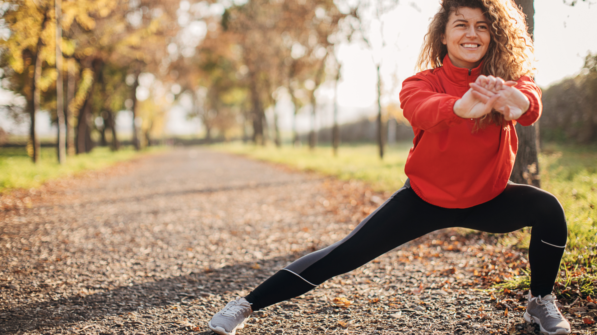 A woman doing side lunges