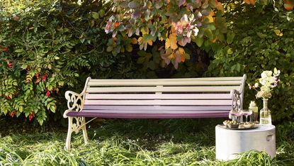 painting garden furniture: garden bench painted in a number of colourful exterior paints