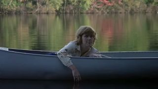 Adrienne King as Alice Hardy floating in a canoe on Crystal Lake in Friday the 13th