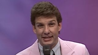 Marc Summers in pink jacket hosting Double Dare