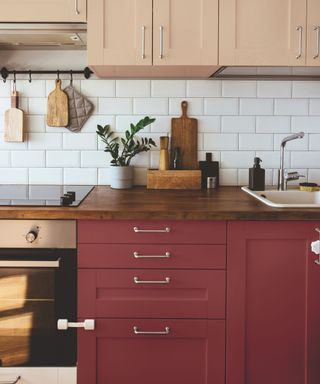 kitchen cabinets painted in brick dust by glidden with pink upper cabinets