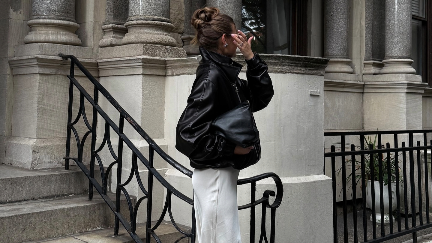 Sara Walker in a leather Brandon Maxwell jacket and lace skirt