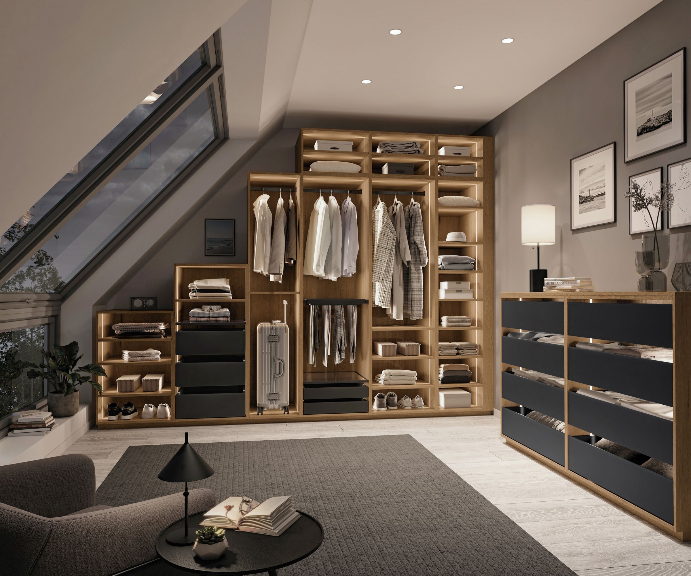 A modern open wardrobe is built into the sloping wall of a loft room. The fitted units feature natural wood shelving, hanging rails, and cubbyholes for clothes and accessories. Subtle spotlights in the ceiling cast warm, even light over the entire space.
